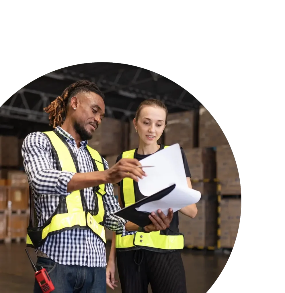 Warehouse managers discussing delivery schedule.